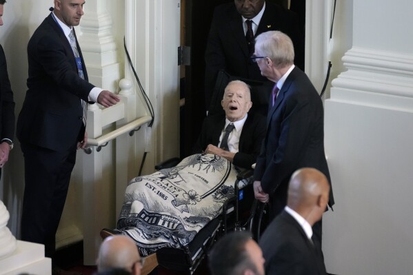 Former President Jimmy Carter, arrives to attend a tribute service for his wife and former first lady Rosalynn Carter, at Glenn Memorial Church, Tuesday, Nov. 28, 2023, in Atlanta. (AP Photo/Andrew Harnik)