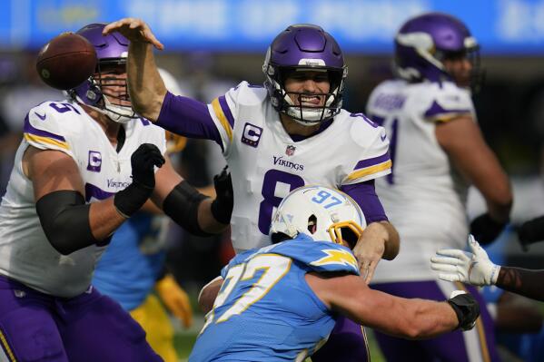 Los Angeles Chargers defensive end Joey Bosa (97) tackles Minnesota Vikings quarterback Kirk Cousins (8), causing a fumble, during the first half of an NFL football game Sunday, Nov. 14, 2021, in Inglewood, Calif. (AP Photo/Gregory Bull)