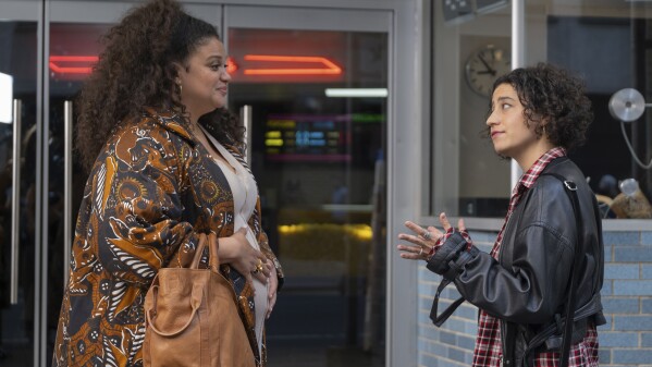 This image released by Neon shows Michelle Buteau, left, and Ilana Glazer in a scene from the film "Babes." (Gwen Capistran/Neon via AP)