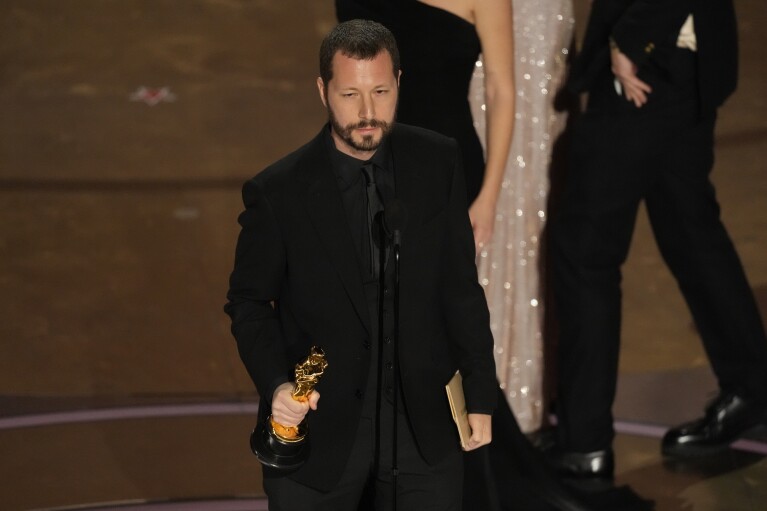 Mstyslav Chernov accepts the award for best documentary feature film for "20 Days in Mariupol" during the Oscars on Sunday, March 10, 2024, at the Dolby Theatre in Los Angeles. (AP Photo/Chris Pizzello)