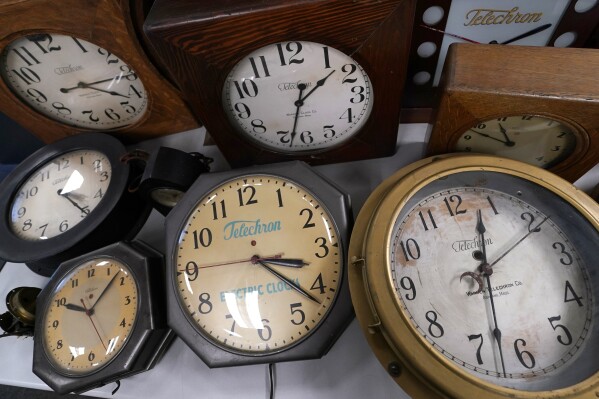 FILE - A selection of vintage clocks are displayed at Electric Time Company, Tuesday, Nov. 1, 2022, in Medfield, Mass. Most of America “springs forward” Sunday, March 10, 2024, for daylight saving time and losing that hour of sleep can do more than leave you tired and cranky the next day. It also could affect your health. (AP Photo/Charles Krupa, File)