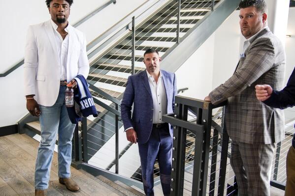 Tennessee Titans first-round NFL football draft pick wide receiver Treylon Burks, left, departs with head coach Mike Wrabel, center, and general manager Jon Robinson, right, after an introductory news conference at Saint Thomas Sports Park in Nashville, Friday, April 29, 2022. (Andrew Nelles/The Tennessean via AP)