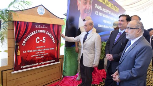 In this photo released by Press Information Department, Pakistan's Prime Minister Shehbaz Sharif, center, unveils plaque during the groundbreaking ceremony of 5th Unit of Chashma Nuclear Power Plant (Chashma-5) in Chashma, Mianwali, Pakistan, Friday, July 14, 2023. Sharif launched the construction of a 1,200-megawatt Chinese-designed nuclear energy project, which will be built at a cost of $3.5 billion as part of the government efforts to generate more clean energy in the Islamic nation. (Press Information Department via AP)