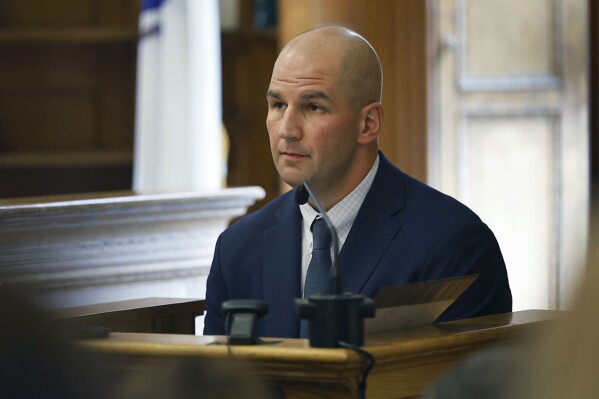 Mass State Police Trooper Michael Proctor listens on the witness stand during the Karen Read murder trial, Wednesday, June 12, 2024, in Norfolk Super Court in Dedham, Mass. Read is facing charges, including second degree murder, in the 2022 death of her boyfriend Boston Officer John O’Keefe. (Greg Derr/The Patriot Ledger via AP, Pool)
