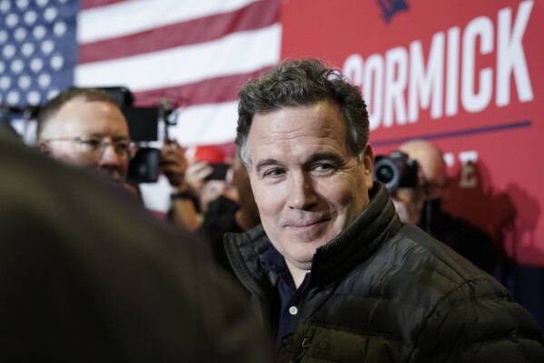 FILE - Dave McCormick, a Republican candidate for U.S. Senate in Pennsylvania, meets with attendees during a campaign event in Coplay, Pa., Jan. 25, 2022. McCormick is expected to announce his second bid for U.S. Senate in Pennsylvania, according to people familiar with his plans, taking on Democratic Sen. Bob Casey after narrowly losing an expensive and bruising GOP primary last year to a Donald Trump-endorsed rival. (AP Photo/Matt Rourke, File)