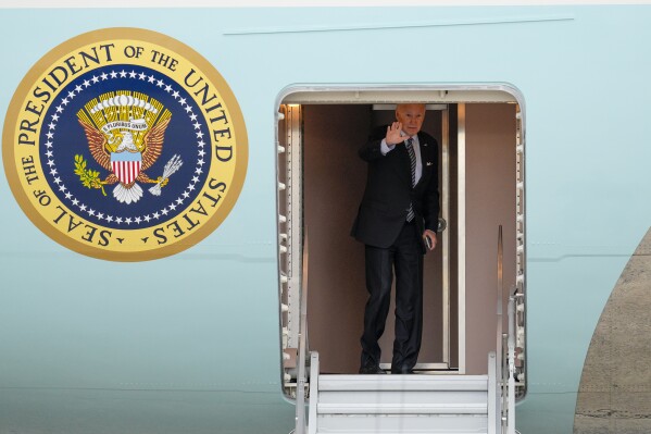 President Joe Biden waves as he boards Air Force One at Andrews Air Force Base, Md., Tuesday, Oct. 17, 2023, en route to Israel. (AP Photo/Jess Rapfogel)