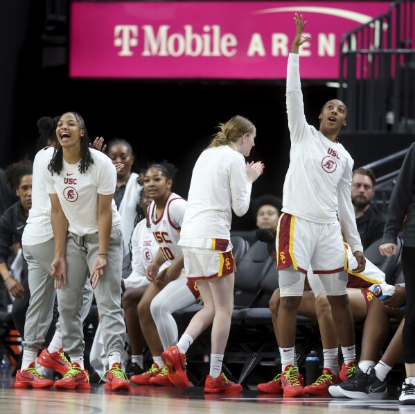 Spring Valley High basketball star Aaliyah Gayles, front right, cheers with her Southern California teammates during their Naismith Basketball Hall of Fame Series NCAA college game against Ohio State in Las Vegas, Monday, Nov. 6, 2023. (K.M. Cannon/Las Vegas Review-Journal via AP)