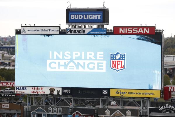 FILE - The NFL's social justice logo is displayed before an NFL football game between the Tennessee Titans and the Houston Texans Sunday, Oct. 18, 2020, in Nashville, Tenn.  The NFL is highlighting its Inspire Change social justice initiative in stadiums and during game broadcasts during the final two weeks of the regular season. Video content will be used to amplify the impactful social justice work done by NFL players, clubs, league, and social justice grant partners to break down barriers to opportunity and end systemic racism.  (AP Photo/Wade Payne, File)