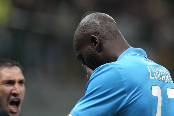 Napoli's Romelu Lukaku celebrates after scoring his side's opening goal during the Serie A soccer match between AC Milan and Napoli at the San Siro stadium, in Milan, Italy, Tuesday, Oct. 29, 2024. (AP Photo/Luca Bruno)