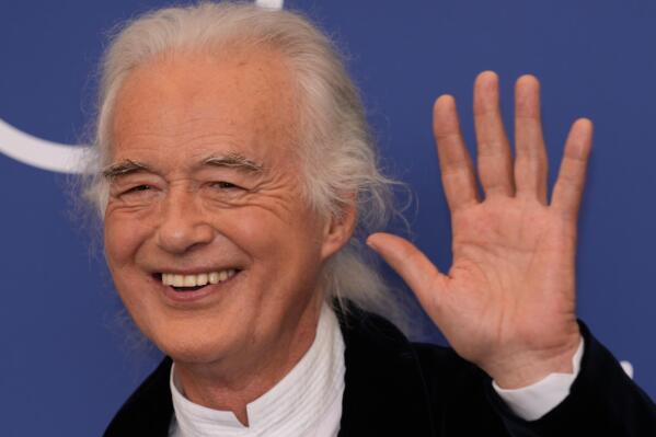Musician Jimmy Page poses at the photo call of the movie 'Becoming Led Zeppelin' at the 78th edition of the Venice Film Festival at the Venice Lido, Italy, Saturday, Sep. 4, 2021. The festival is on Sept. 1 through Sept. 11. (AP Photo/Domenico Stinellis)