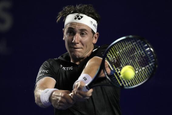 Casper Ruud, of Norway, returns a ball during a match against Guido Andreozzi, of Argentina, in a Mexican Open tennis tournament in Acapulco, Mexico, Monday, Feb. 27, 2023. (AP Photo/Eduardo Verdugo)