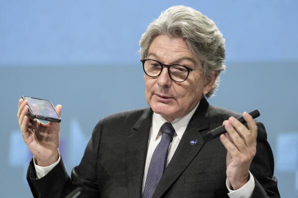 FILE - European Commissioner for Internal Market Thierry Breton speaks during a media conference on a common charging solution for mobile phones at EU headquarters in Brussels, Thursday, Sept. 23, 2021. European Union officials agreed Tuesday, June 7, 2022 on new rules requiring a uniform charging cord for smartphones and other devices, a move that would make life easier for consumers fed up with rummaging through a tangle of cables for the right one.  (AP Photo/Thierry Monasse, File)