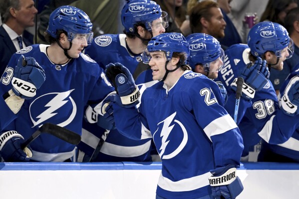 Tampa Bay Lightning center Brayden Point (21) celebrates after his goal during the third period of an NHL hockey game against the New York Rangers, Thursday, March 14, 2024, in Tampa, Fla. (AP Photo/Jason Behnken)