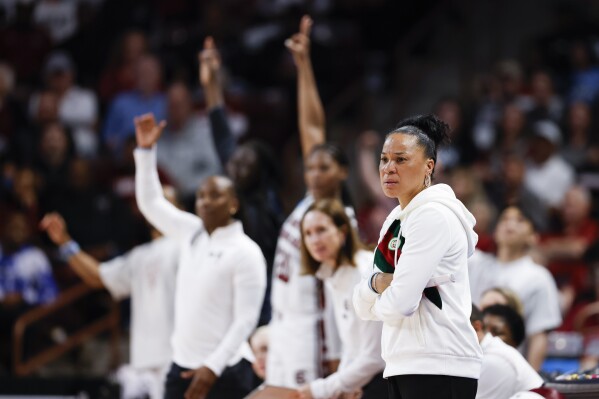 South Carolina head coach Dawn Staley watches her team play against Presbyterian during the first half of a first-round college basketball game in the women's NCAA Tournament in Columbia, S.C., Friday, March 22, 2024. (AP Photo/Nell Redmond)