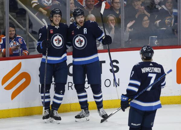 Morrissey has 2 goals, assist as Jets outlast Oilers 7-5