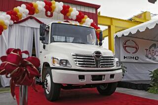 FILE - The first Hino truck assembled in North America is unveiled Tuesday, Oct. 19, 2004, at the Toyota's longest operating U.S. manufacturing facility, TABC, Inc. in Long Beach, Calif.  Hino Motors, a truck maker that’s part of the Toyota group, systematically falsified emissions data, dating back as far back as 2003, according to a special investigation disclosed Tuesday, Aug. 2, 2022.  (AP Photo/Damian Dovarganes, File)