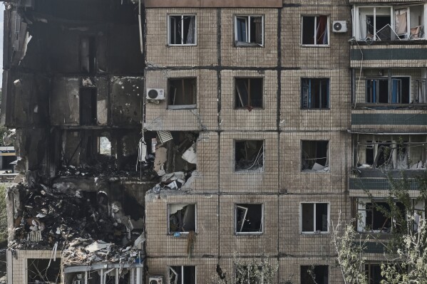 An apartment building after it was hit during a Russian missile strike in Kryvyi Rih, Ukraine, Monday, July 31, 2023. (AP Photo/Libkos)