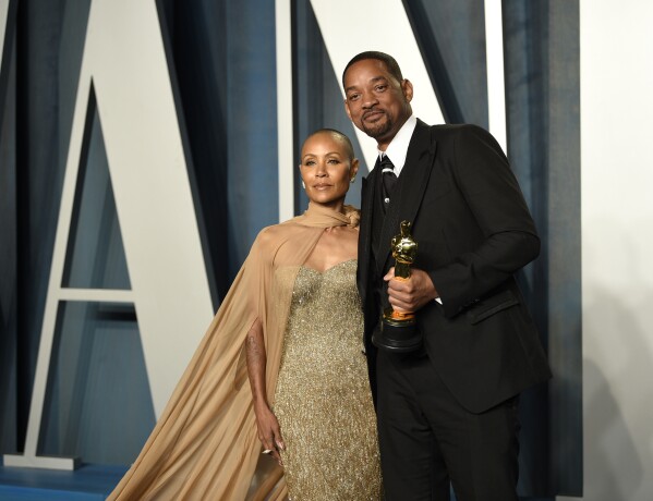 FILE - Jada Pinkett Smith, left, and Will Smith arrive at the Vanity Fair Oscar Party on Sunday, March 27, 2022, in Beverly Hills, Calif. Pinkett Smith and husband Will Smith have lived what she says are “completely separate lives” since 2016. Pinkett Smith made the revelation in an interview with Hoda Kotb. The prominent Hollywood couple married in 1997 and have addressed separations and marital troubles. But never this specifically. (Photo by Evan Agostini/Invision/AP, File)