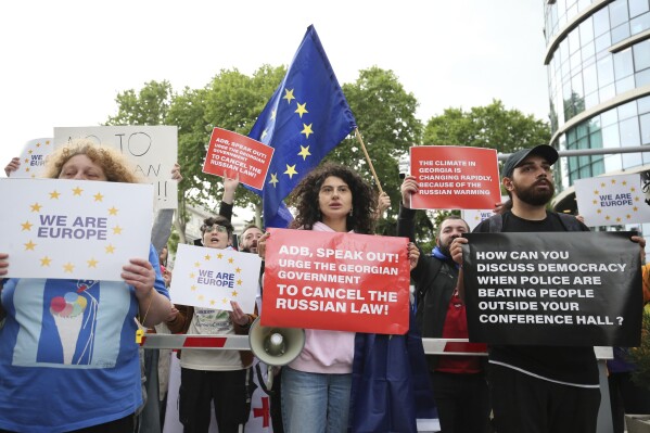 Demonstrators gather outside the Biltmore Hotel in Tbilisi where Asia Development Bank Annual set the 57th Annual Meeting of the ADB Board of Governors which is held to denounce the 