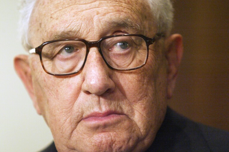 FILE - Former Secretary of State Henry Kissinger is seen during a meeting with President Vladimir Putin in the Novo-Ogaryovo residence outside Moscow, June 6, 2006. Kissinger, the diplomat with the thick glasses and gravelly voice who dominated foreign policy as the United States extricated itself from Vietnam and broke down barriers with China, died Wednesday, Nov. 29, 2023. He was 100. (AP Photo/Sergey Ponomarev, File)