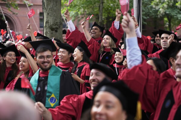 Students cheer during Harvard University's commencement ceremonies, Thursday, May 29, 2025 in Cambridge, Mass. (AP Photo/Charles Krupa)