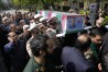 Army members carry the flag-draped coffin of Iranian Foreign Minister Hossein Amirabdollahian, who was killed in a helicopter crash along with President Ebrahim Raisi, during a funeral ceremony at the foreign ministry in Tehran, Iran, Thursday, May 23, 2024. The death of Raisi, Amirabdollahian and six others in the crash on Sunday comes at a politically sensitive moment for Iran, both at home and abroad. (AP Photo/Vahid Salemi)