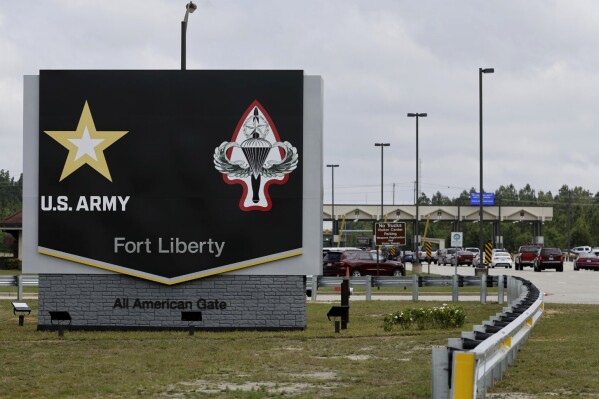 FILE - The new Fort Liberty sign is displayed outside the base on Friday, June 2, 2023 in Fort Liberty, N.C. U.S. special operations commanders are having to do more with less and they're learning from the war in Ukraine, That means juggling how to add more high-tech experts to their teams while still cutting their overall forces by about 5,000 troops over the next five years. (AP Photo/Karl B DeBlaker, File)