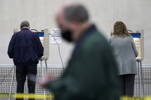 FILE - People vote at the Milwaukee County Sports Complex, Nov. 3, 2020, in Franklin, Wis. Early voting begins Tuesday, March 19, 2024, in Wisconsin for a host of local races, two proposed constitutional amendments that could alter how future elections are run and the-now anticlimactic presidential primary. (AP Photo/Morry Gash, File)