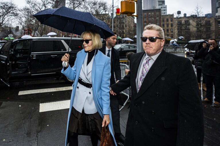E. Jean Carroll arrives at Federal Court, Thursday, Jan. 25, 2024, in New York. Former President Donald Trump could return to a New York courtroom Thursday to defend himself against a lawsuit seeking more than $10 million for things he said about Carroll after she accused him of sexual assault.(AP Photo/Peter K. Afriyie)