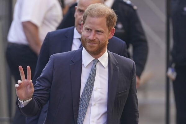 Prince Harry gestures as he arrives at the High Court in London, England, Tuesday, April 8, 2025. (AP Photo/Alberto Pezzali)