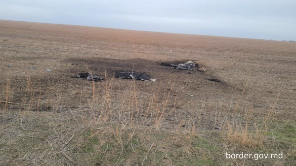 This image released by Moldova's Border Police on Sunday, Feb. 11, 2024, shows, according to the official statement, remains of a Shahed-type drone that crashed near the Etulia, Moldova, near the Moldova-Ukraine border and in the general area of the the Ukrainian Danube port of Ismail. The port was the target of a Russian air-strike in the early hours of Feb. 10. (Moldovan Border Police via AP)