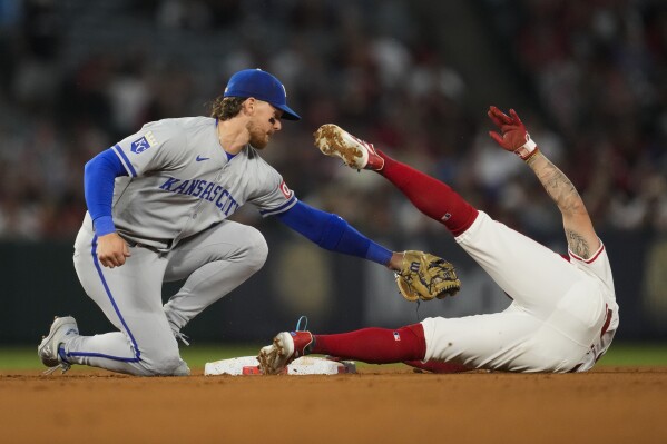 Los Angeles Angels' Zach Neto (9) steals second ahead of a throw to Kansas City Royals shortstop Bobby Witt Jr. (7) during the fifth inning of a baseball game in Anaheim, Calif., Friday, May 10, 2024. (AP Photo/Ashley Landis)