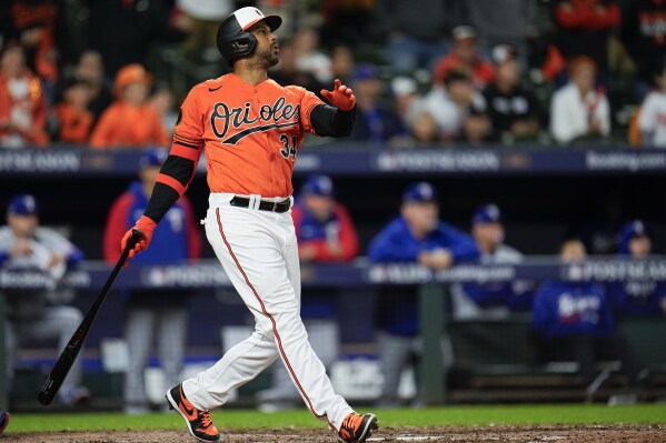 FILE - Baltimore Orioles' Aaron Hicks looks after his three-run home run during the ninth inning in Game 2 of an American League Division Series baseball game against the Texas Rangers, Sunday, Oct. 8, 2023, in Baltimore. Outfielder Aaron Hicks has agreed to a one-year, $740,000 contract with the Los Angeles Angels. The Angels announced the deal with the Los Angeles-area native on Monday, Jan. 29, 2024.(AP Photo/Julio Cortez, File)
