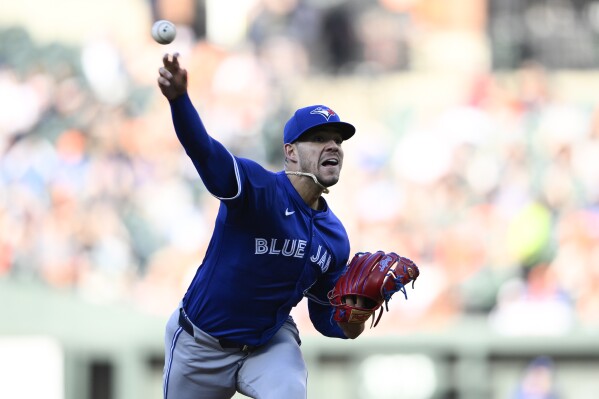 Toronto Blue Jays starting pitcher Jose Berrios throws during the first inning of a baseball game against the Baltimore Orioles, Monday, May 13, 2024, in Baltimore. (AP Photo/Nick Wass)