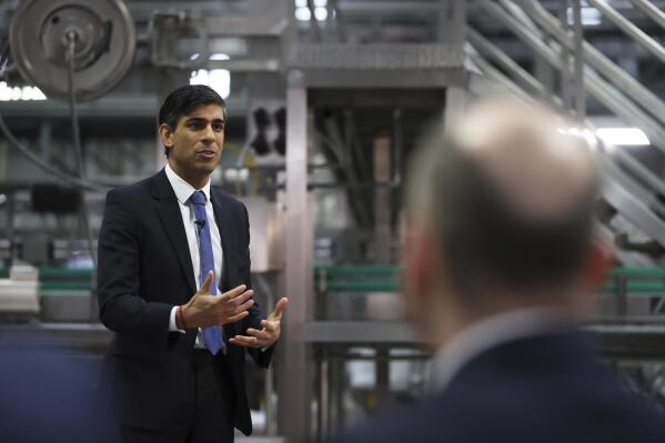 Britain's Prime Minister Rishi Sunak holds a Q&A session with local business leaders during a visit to Coca-Cola HBC in Lisburn, Northern Ireland, Tuesday Feb. 28, 2023. Sunak traveled to Belfast on Tuesday to sell his landmark agreement with the European Union to its toughest audience: Unionist politicians who fear post-Brexit trade rules are weakening Northern Ireland’s place in the United Kingdom. (Liam McBurney/Pool via AP)