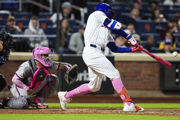 New York Mets' Brandon Nimmo (9) hits a game-winning two-run home run during the ninth inning of a baseball game against the Atlanta Braves, Sunday, May 12, 2024, in New York. (AP Photo/Julia Nikhinson)