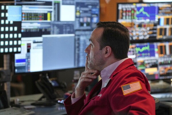 Robert Greason works on the floor at the New York Stock Exchange in New York, Thursday, April 3, 2025. (AP Photo/Seth Wenig)