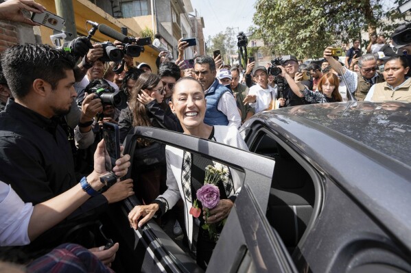 Ruling party presidential candidate Claudia Sheinbaum leaves the polling station where she voted during general elections in Mexico City, Sunday, June 2, 2024. (AP Photo/Eduardo Verdugo)