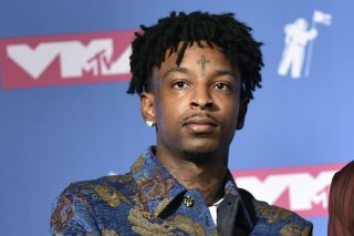 
              CORRECTS RELEASE DATE - FILE - In this Aug. 20, 2018, file photo, 21 Savage poses in the press room at the MTV Video Music Awards at Radio City Music Hall in New York. A lawyer for rapper 21 Savage said Tuesday, Feb. 12, 2019, that he has been granted bond for release from federal immigration custody, but the bond was granted too late Tuesday for him to be released right away. He said he anticipates the rapper, whose given name is She'yaa Bin Abraham-Joseph, will be released Wednesday, Feb. 13. (Photo by Evan Agostini/Invision/AP, File)
            