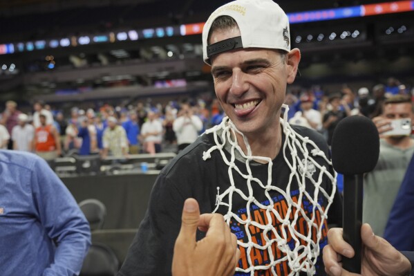 Florida head coach Todd Golden celebrates after Florida beat Houston in the national championship at the Final Four of the NCAA college basketball tournament, Monday, April 7, 2025, in San Antonio. (AP Photo/Eric Gay)