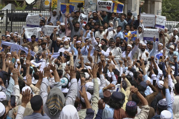 Muslim protestors chant slogans during a rally to denounce burning of Islam's holy book 'Quran', in Peshawar, Pakistan, Friday, July 7, 2023. Muslims rallied in across Pakistan to observe a "Day of the Sanctity of Quran" after the South Asian Islamic nation's prime minister issued a call for anti-Sweden protests over last week's burning of Islamic holy book 'Quran' in Stockholm. (AP Photo/Muhammad Sajjad)