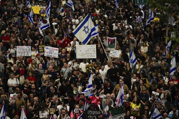 People protest against Israeli Prime Minister Benjamin Netanyahu's government and call for the release of hostages held in the Gaza Strip by the Hamas militant group in Tel Aviv, Israel, Saturday, April 27, 2024. (AP Photo/Ohad Zwigenberg)