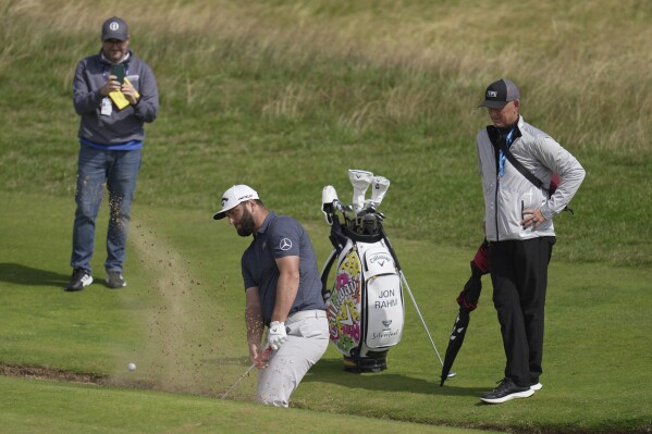 Spain's Jon Rahm plays out of a bunker on the 9th green during a practice round for the British Open Golf Championships at the Royal Liverpool Golf Club in Hoylake, England, Wednesday, July 19, 2023. The Open starts Thursday, July 20. (AP Photo/Kin Cheung)