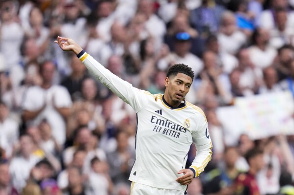 Real Madrid's Jude Bellingham celebrates after scoring his side's second goal during the the Spanish La Liga soccer match between Real Madrid and Cadiz at the Santiago Bernabeu stadium in Madrid, Spain, Saturday, May 4, 2024. (AP Photo/Manu Fernandez)