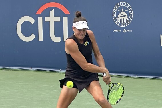 Jennifer Brady of the United States hits a backhand against Anhelina Kalinina of Ukraine in their first-round match at the DC Open, Tuesday, Aug. 1, 2023, in Washington. Brady won her first WTA Tour match in two years on Tuesday, overwhelming 28th-ranked Anhelina Kalininia 6-2, 6-1 in a little over an hour at the DC Open. (AP Photo/Howard Fendrich)