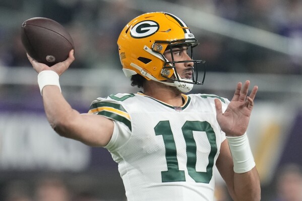 Green Bay Packers' Jordan Love throws during the first half of an NFL football game against the Minnesota Vikings Sunday, Dec. 31, 2023, in Minneapolis. (AP Photo/Abbie Parr)