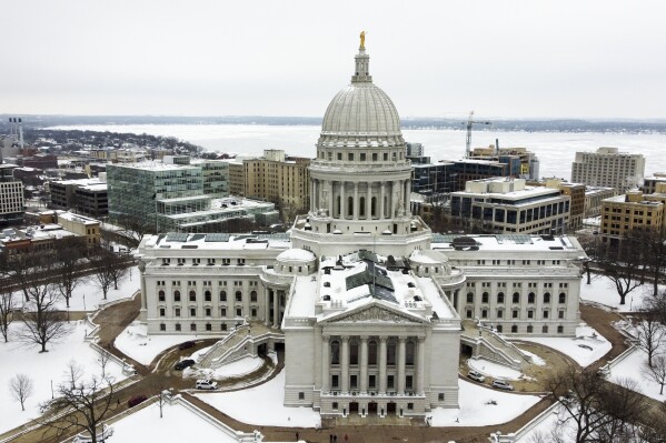 FILE - This image taken with a drone shows the Wisconsin State Capitol on Dec. 31, 2020, in Madison, Wis. Most of the newly ordered maps redrawing Wisconsin's political boundaries for the state Legislature would keep Republicans in majority control, but their dominance would be reduced, according to an independent analysis of the plans. (AP Photo/Morry Gash, file)
