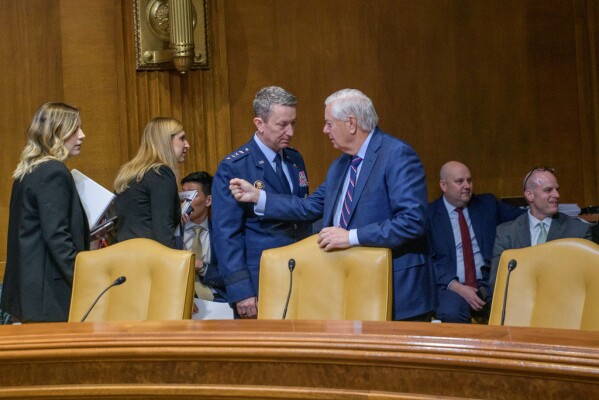 Sen. Lindsey Graham, R-S.C., right, talks with Gen. John Caine, chairman of the Joint Chiefs of Staff, left, prior to a Senate Committee on Appropriations subcommittee hearing to examine proposed budget estimates for fiscal year 2026 for the Department of Defense, on Capitol Hill, Wednesday, June 11, 2025, in Washington. (AP Photo/Rod Lamkey, Jr.)