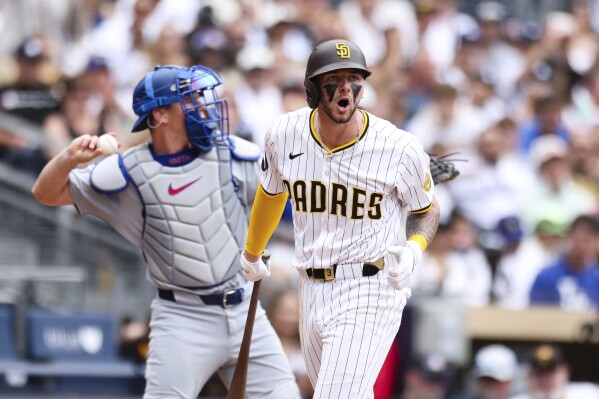San Diego Padres' Jackson Merrill reacts after striking out against the Los Angeles Dodgers in the eighth inning of a baseball game Wednesday, June 11, 2025, in San Diego. (AP Photo/Derrick Tuskan)