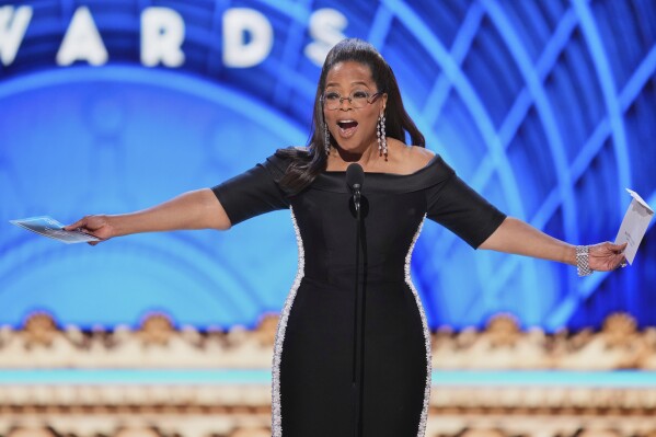 Oprah Winfrey presents the award for best performance by an actress in a leading role in a musical during the 78th Tony Awards on Sunday, June 8, 2025, at Radio City Music Hall in New York. (Photo by Charles Sykes/Invision/AP)
